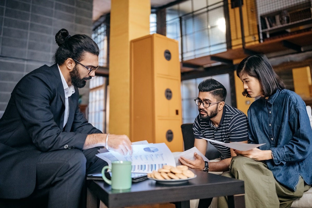 Business consultation meeting reviewing financial reports