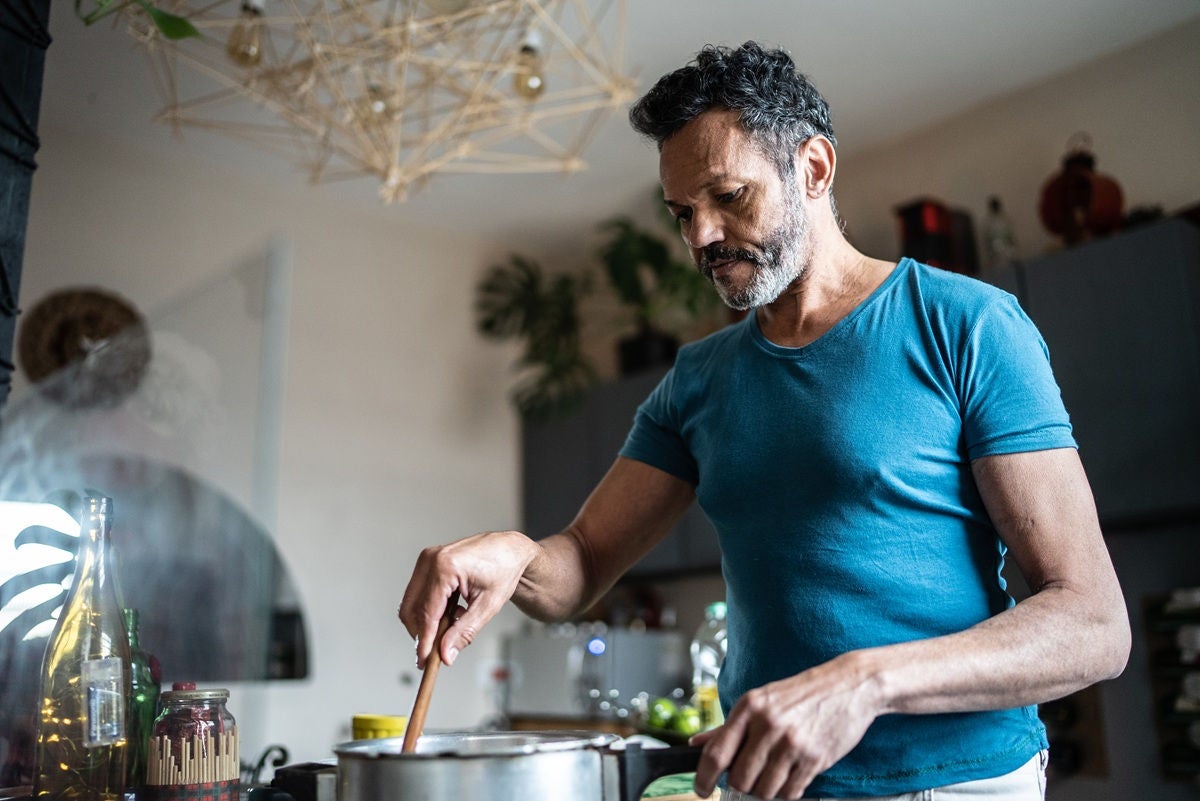 Mature man cooking at home