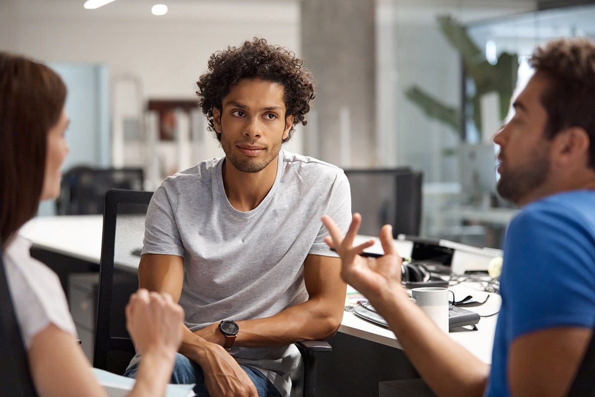 Team discussion in modern office meeting space