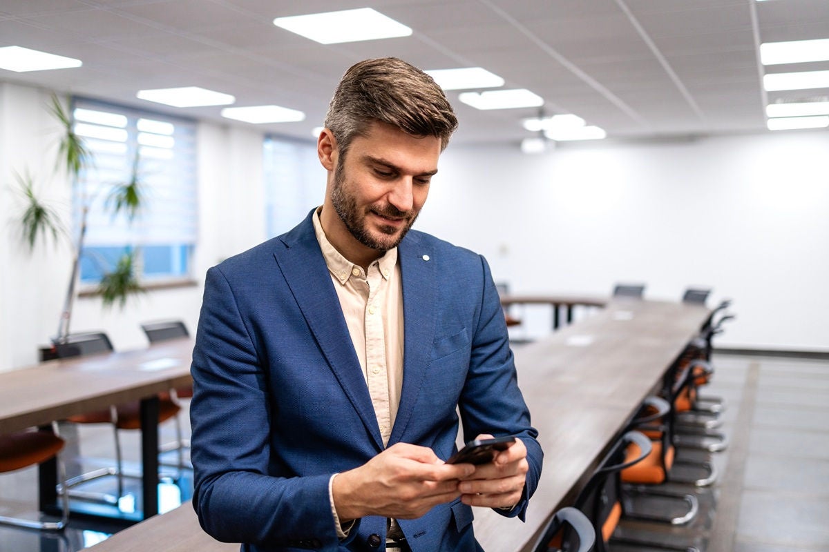 Small Business owner using mobile phone for online banking