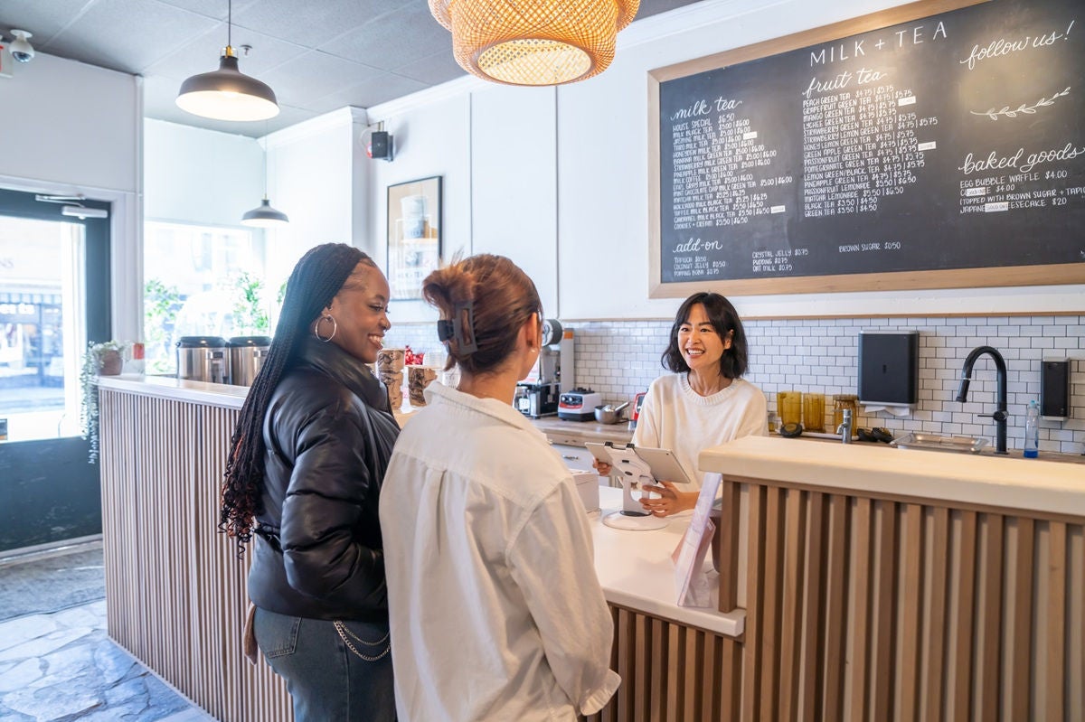 Customers ordering drinks at a modern café