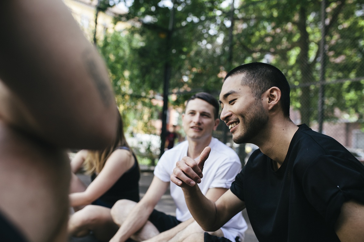 Group of friends talking together in urban outdoor setting