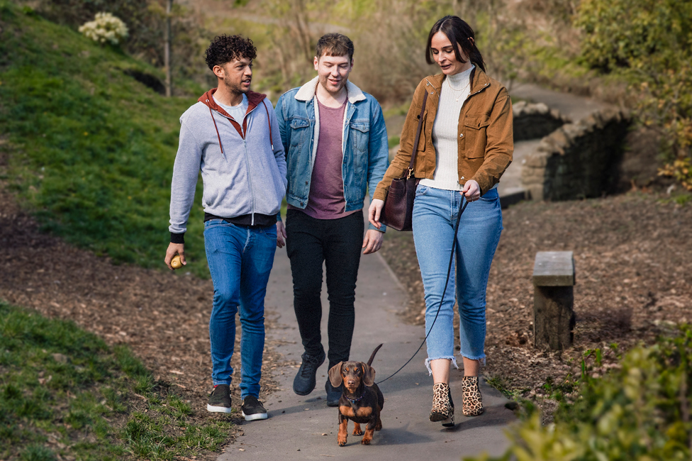 a group of friends walking in the park